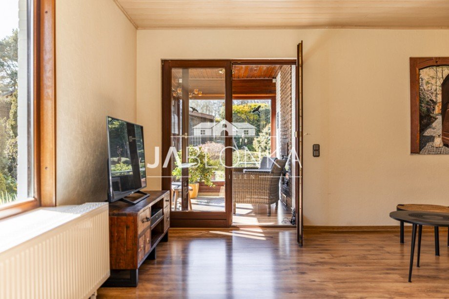 Wohnzimmer mit Wintergarten Bungalow Brunsmark